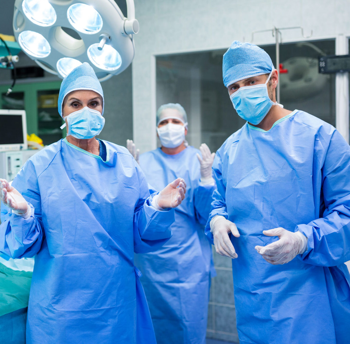 portrait of surgeons preparing for operation in operation room